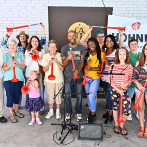 Adults and children with musical instruments