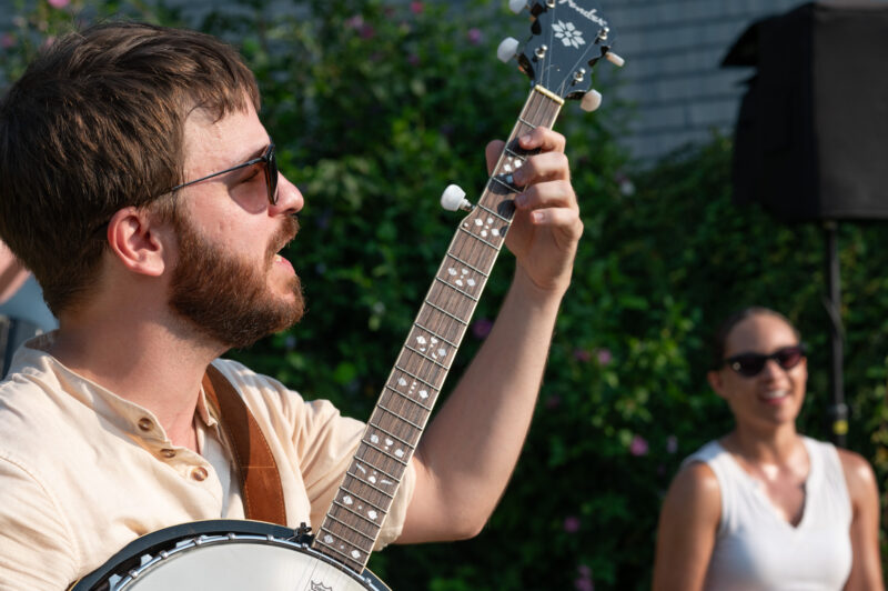 A man playing his banjo